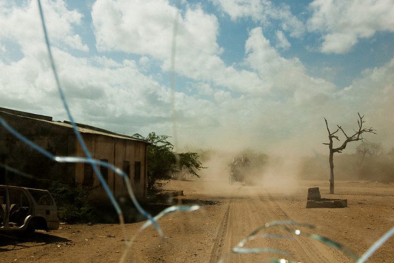 The streets are seen through the windshield of an armored personnel carrier (APC) during a 
routine AMISOM patrol in the recently reclaimed town of Qoryooley, Lower Shabelle, 
Somalia, April 29, 2014. ©Private