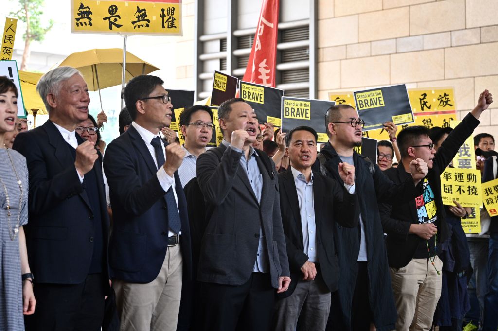Benny Tai and eight other Umbrella Movement leaders outside court on 9 April. AFP/Getty
