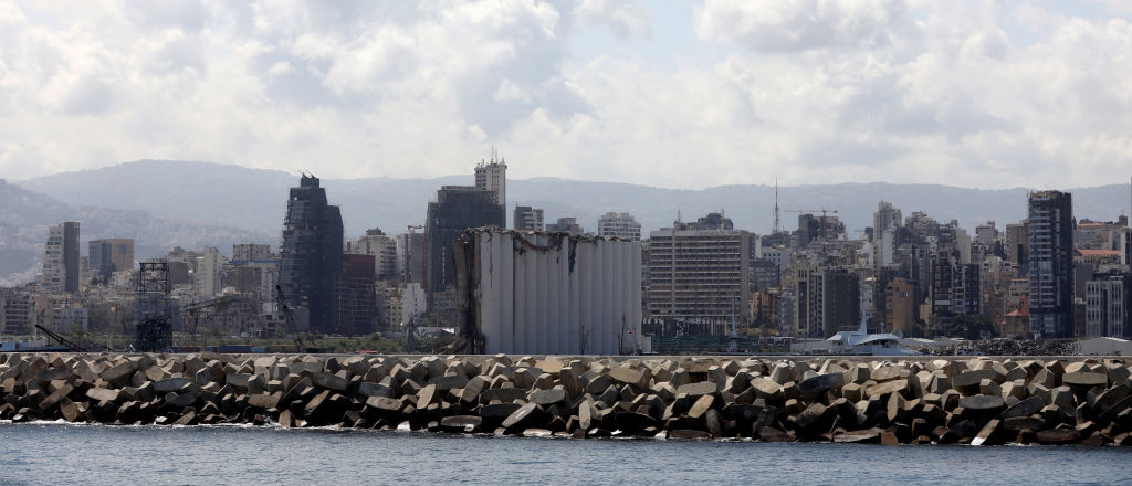 Damaged silos of Beirut port with Beirut city in the background