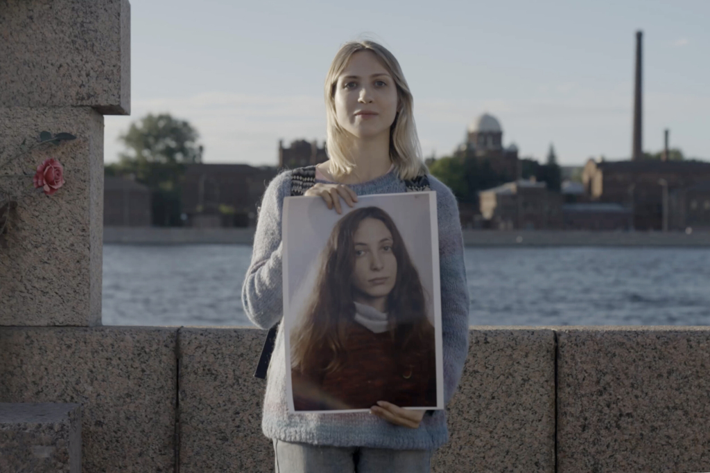 Sonia is holding a photo of her partner Aleksandra. 