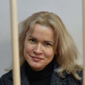 Portrait of Russian journalist and anti-war activist Maria Ponomarenko behind bars.