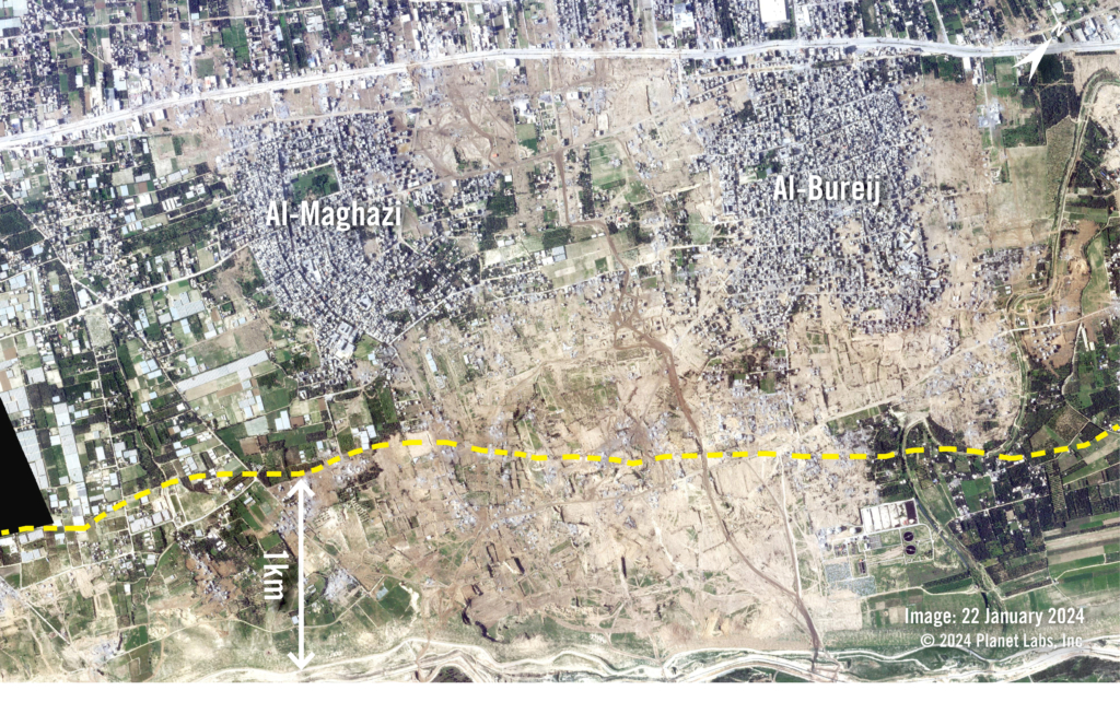 Satellite image shows two towns before parts of them were destroyed. A yellow dotted line shows the 1km mark.