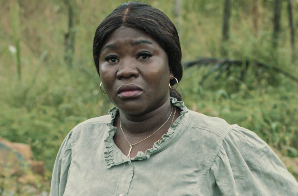 Konima Doumbia, one of the farmers affected by forced evictions in Abidjan, looking into the camera with eyes full of tears. 