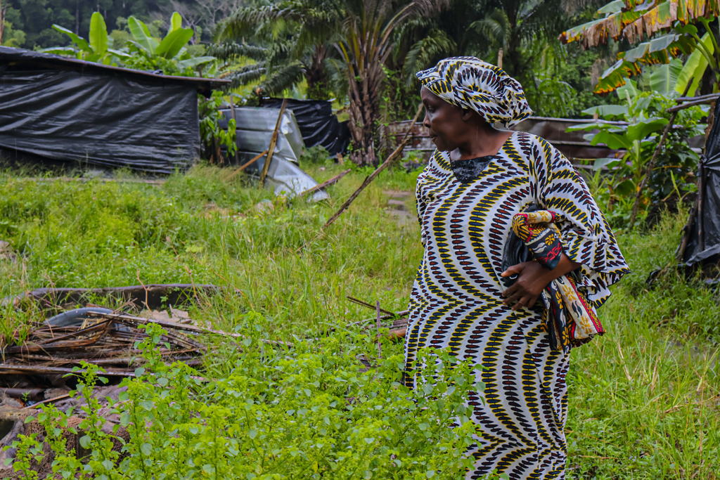 65-year-old Sophie Baka on the site of his farm demolished in February 2024. 