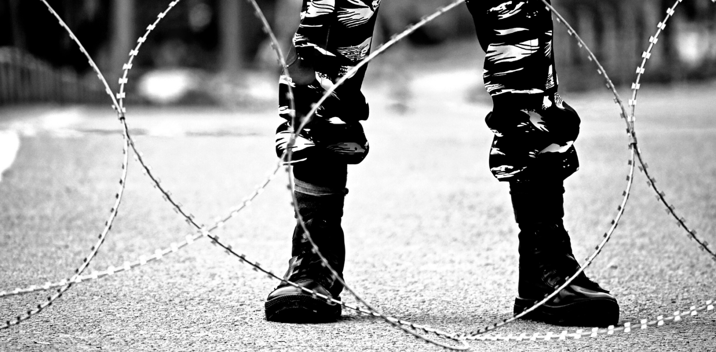soldier stands alert during restrictions in Kashmir