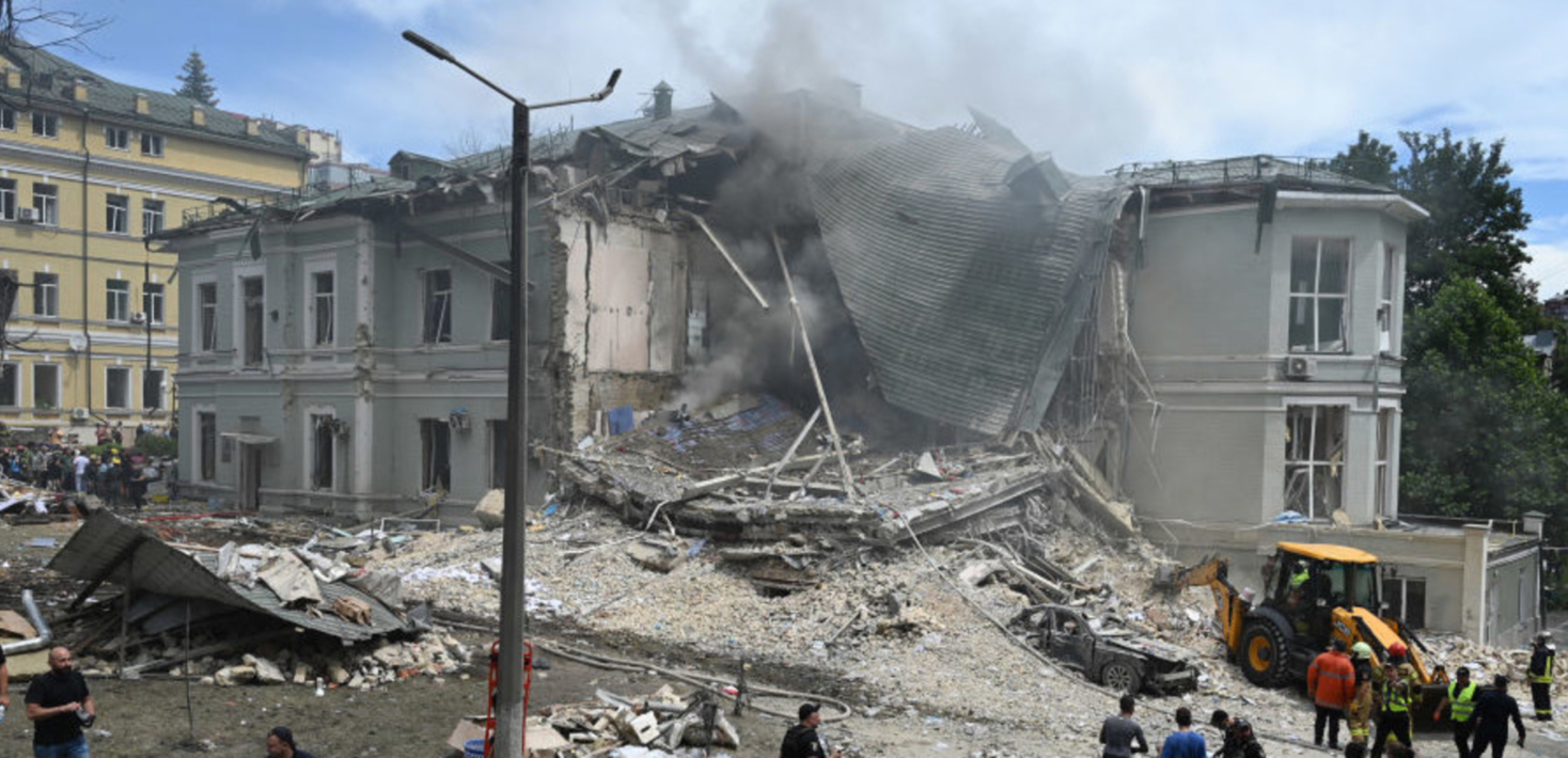 Part of a grey hospital building is reduced to rubble in Kyiv, Ukraine.